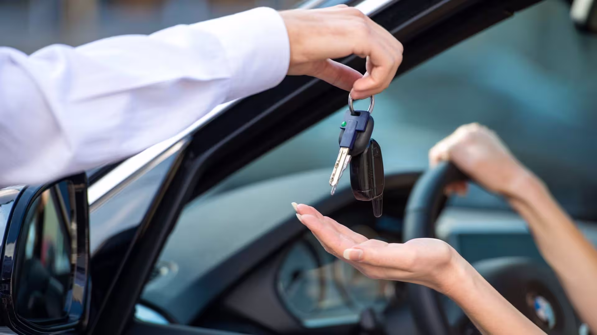 car keys being handed to a client